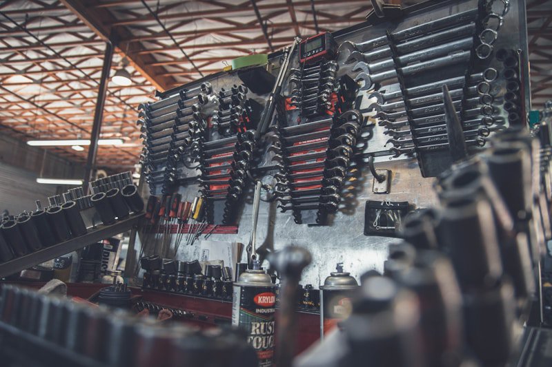 Always pair a history report with a mechanic's inspection Mechanic working under the hood of a car